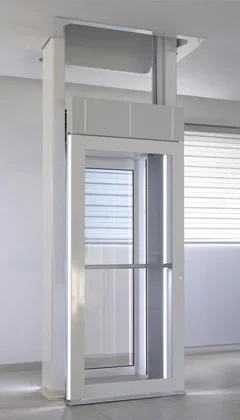 Luma through the floor lift installed in front of a brightly lit window.