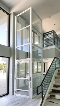 Vertical platform lift enclosure in a white frame