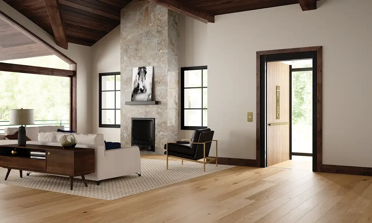 Luxury living room with vaulted wood ceiling, stone fireplace, black accent doors, hardwood floors, and a residential home elevator with open door and illuminated control panel integrated into the space.