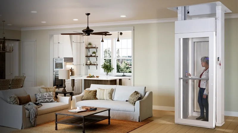A woman using the Luma through the floor lift in the comfort of her living room.