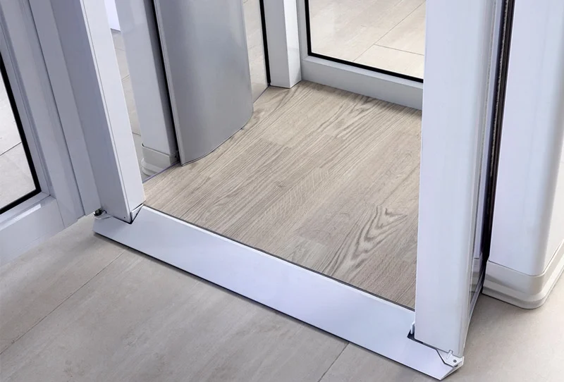 The Savaria Luma through the floor lift showcasing the non skid flooring and sloped entrance for easy accessibility.