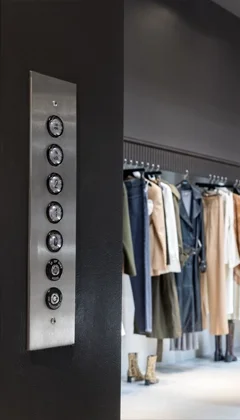 Hall Call Buttons of a Savaria M-1504 Material Lift, installed in a retail setting.