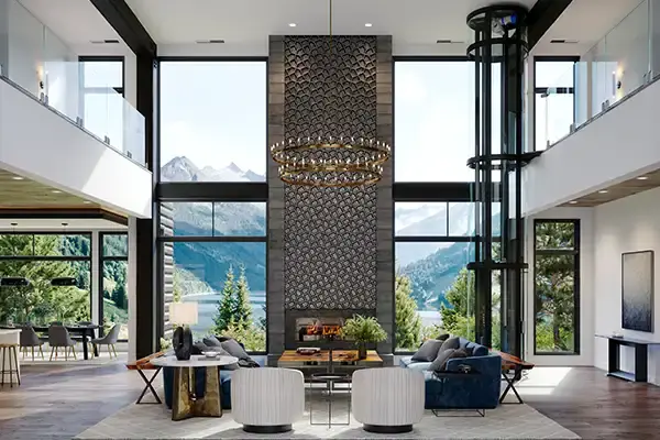 Glass residential elevator integrated into a large modern living room with tall windows, a central fireplace, and mountain views.