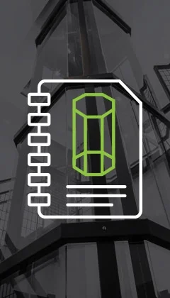 A glass outdoor elevator structure with metal framing, shown in grayscale with an overlaid green icon of an elevator on a notebook graphic.
