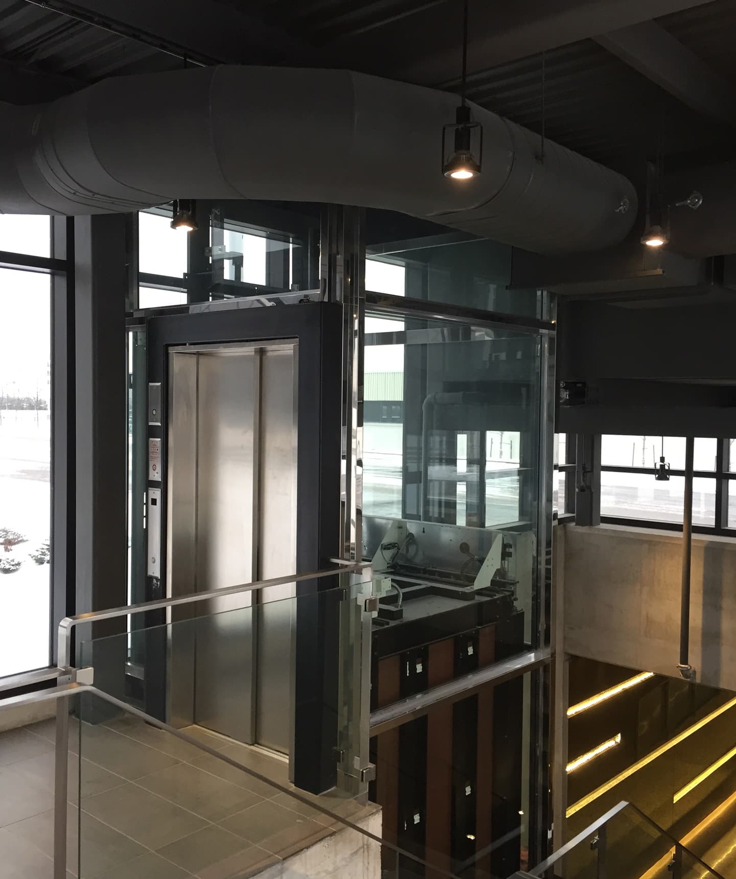 Louis Vuitton's Spiralling Double-Helix Glass Elevator — Elevator